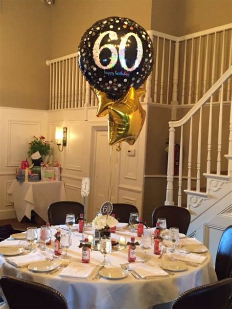 60th birthday party centerpiece in black and gold ...