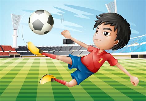 A boy playing soccer at the soccer field   Download Free ...