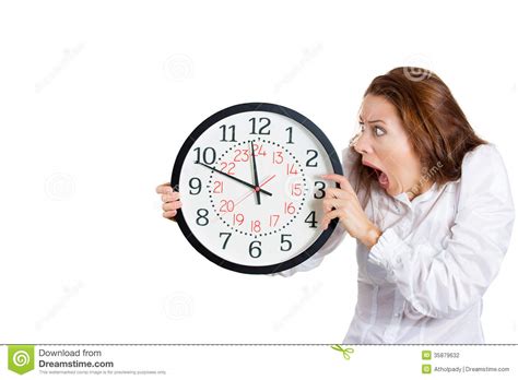 A Business Woman Looking Anxiously At A Clock Stock Photo ...