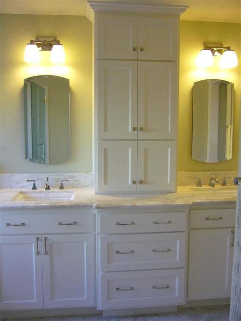 A tall, custom tower between the double sinks provides ...