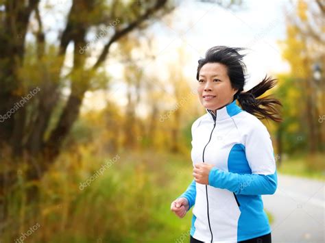Active woman in her 50s running and jogging — Stock Photo ...