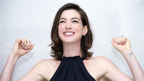 Anne hathaway bares her baby bump on instagram before the ...