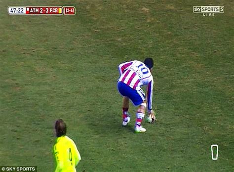 Arda Turan hurls his boot at a linesman during Atletico ...