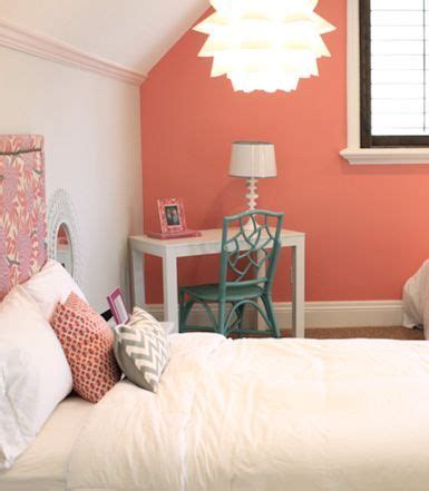 bedroom with coral peach accent wall, pantone blooming ...