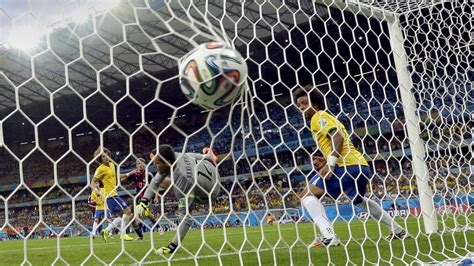 Brazil s goalkeeper Julio Cesar can not stop a shot by ...