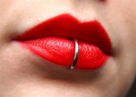 Bright red lips with lower lip piercing. | Tattoos ...