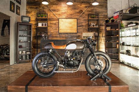 Cafe racer motorbike parked inside custom motorbike shop ...