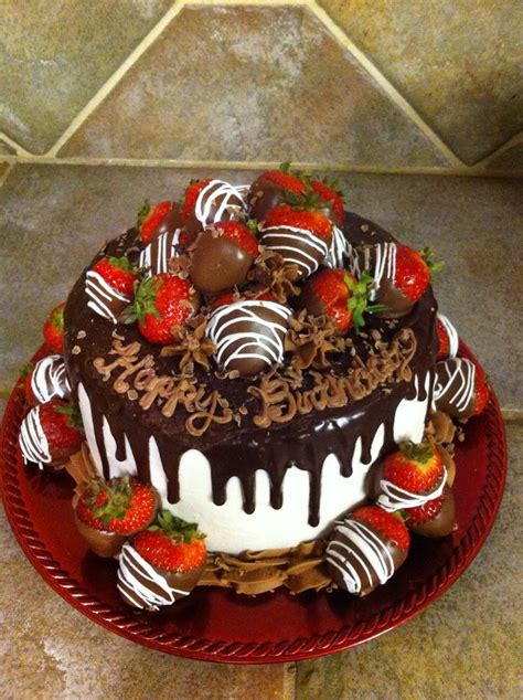 cake decorated with chocolate covered strawberries ...