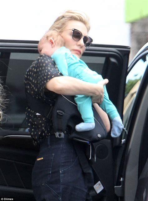 Cate Blanchett cradles her newly adopted daughter Edith on ...