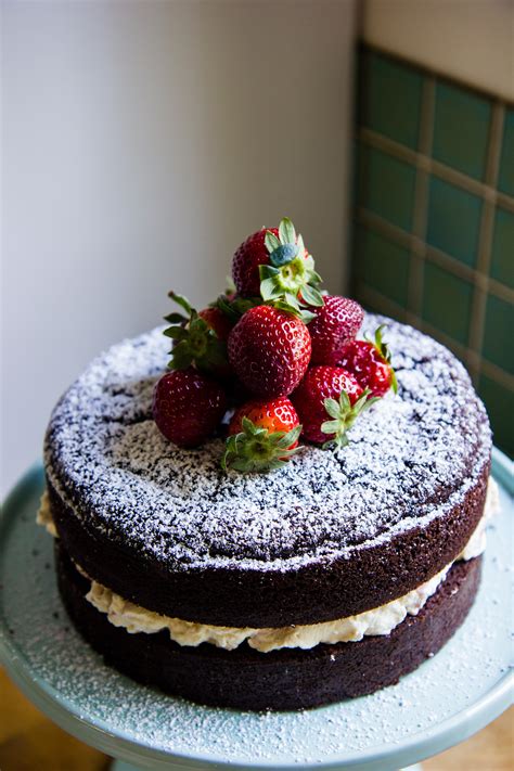 Chocolate celebration cake with strawberries and cream ...