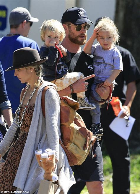 Chris Hemsworth carries twin sons Tristan and Sacha on ...