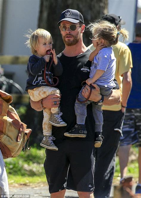 Chris Hemsworth carries twin sons Tristan and Sacha on ...