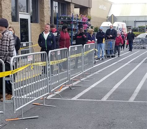 Customers at a Walmart in Rehoboth Beach, Delaware wait in ...