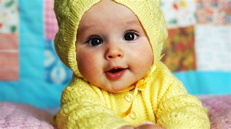 Cute Baby Is Wearing Yellow Knitted Wool Dress Lying Down ...
