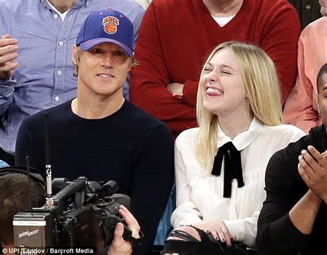 Dakota Fanning can t stop laughing as she attends ...