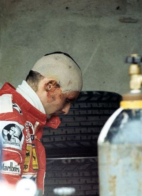 determination; a still wounded Niki Lauda in the pits during the 1976 ...