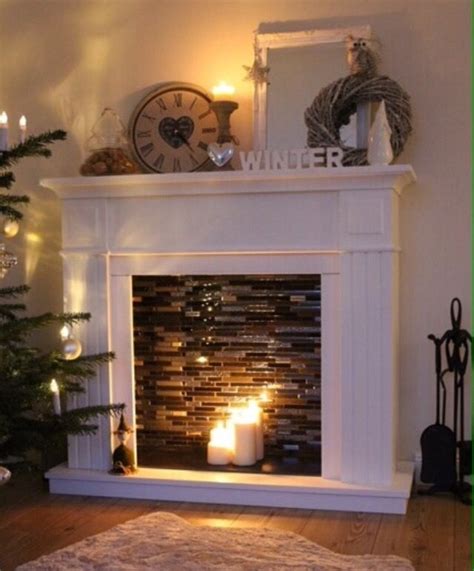 DIY faux fireplace with candles makes room warmer and cozy ...