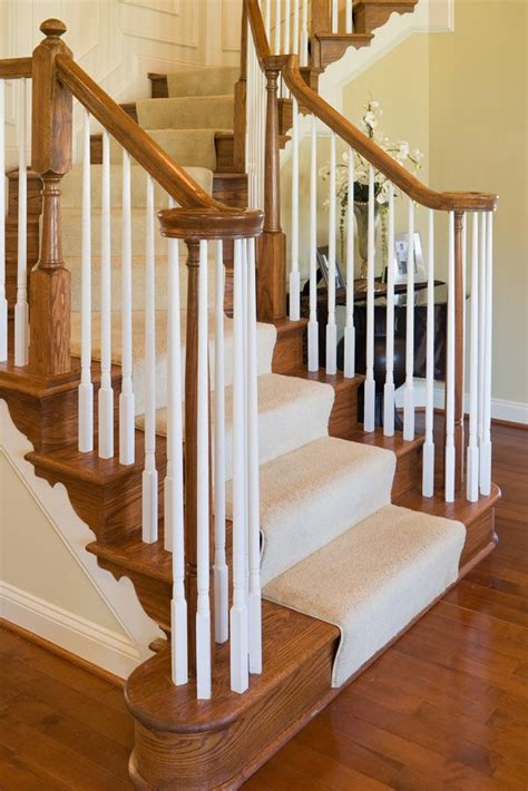 Elegant oak staircase with carpet runner and wide treads ...