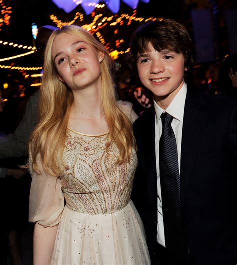 Elle Fanning and Joel Courtney Photos Photos   Premiere Of ...