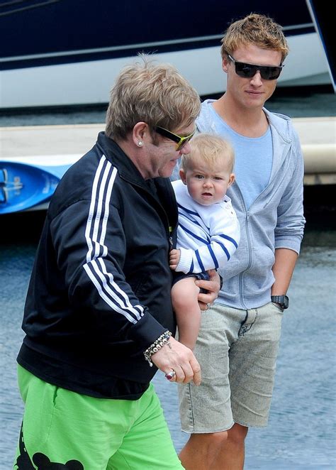 Elton John Holds His Son   Zimbio