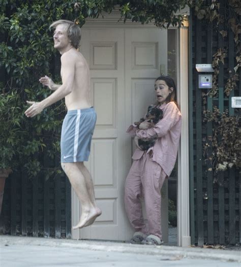 EMILIA CLARKE in Pyjamas with Her Dog Outside Her House in ...