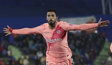 FC Barcelona s Luis Suarez celebrates after scoring during ...