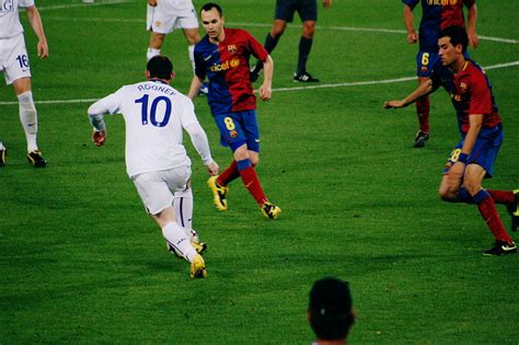 File:Rooney defended by Iniesta, Busquets, UEFA Champions ...