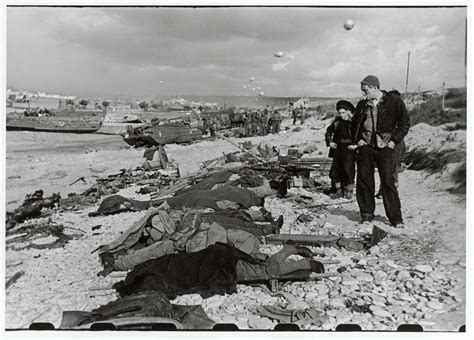 [French fishermen looking at the bodies of some of the men killed ...