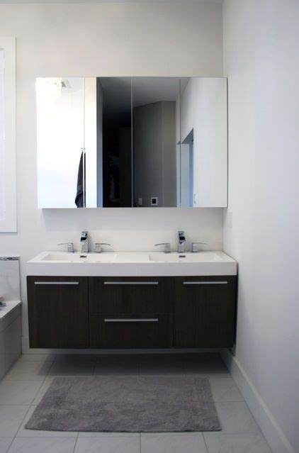 from Houzz: Two Ikea mirrored medicine cabinets are hung ...