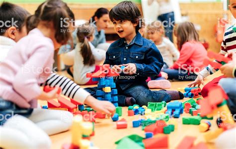 Group Of Children Playing With Blocks In Kindergarten ...