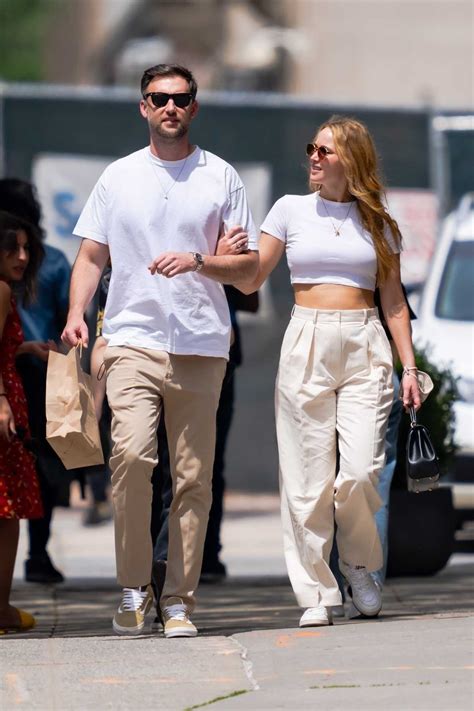 Jennifer Lawrence in a White Top Walks Arm in Arm with Her Husband in ...