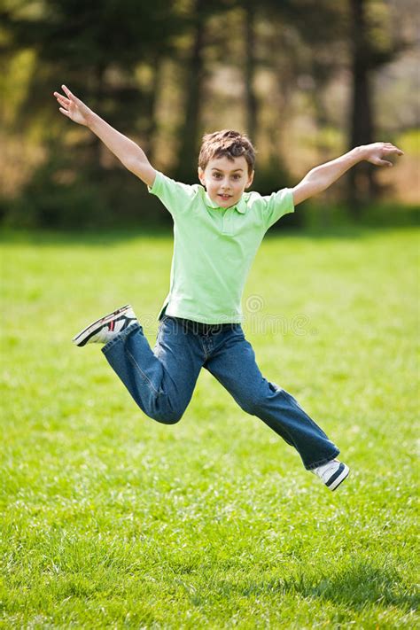 Kid jumping for joy stock photo. Image of happiness, jump ...