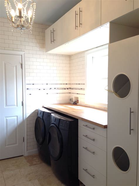 Laundry room with Ikea Akumum cabinets and Applad doors ...