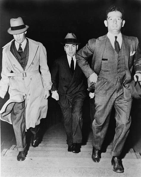 Lucky Luciano 1896 1962 , being escorted into court by ...