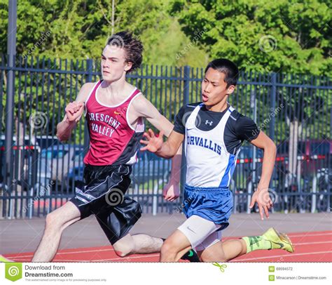 Male High School Athletes Run 200 Meter Race in Track Meet Editorial ...