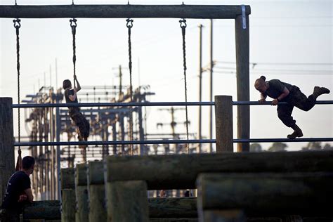 Marines navigate through an obstacle course on Marine Corps Base Camp ...