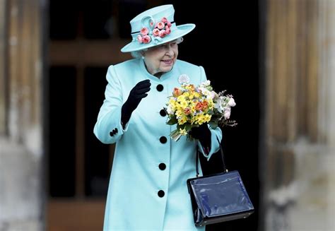Queen Elizabeth II Drives A Jaguar Back From Church ...