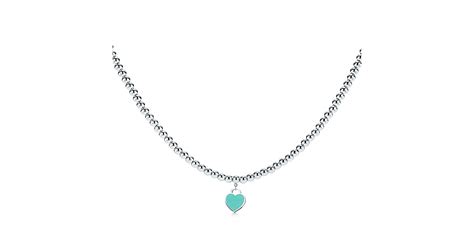 Return to Tiffany heart tag necklace in sterling silver on a beaded ...