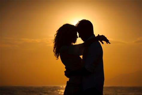 Romantic Couple At Sunset Stock Photo   Download Image Now ...
