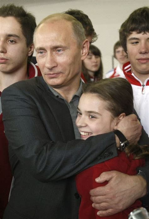 Russia s Prime Minister Vladimir Putin hugs figure skater ...