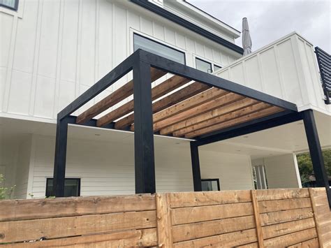 Steel Pergola with Cedar Beams – Crafted Outdoor Living & Landscape Design