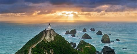 Sunrise at Nugget Point New Zealand | Nugget Point, New ...