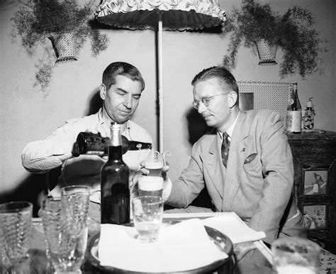 The Italian American Mafia boss Lucky Luciano pours a beer ...