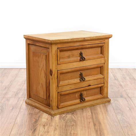This Mexican nightstand is featured in a solid wood with a ...
