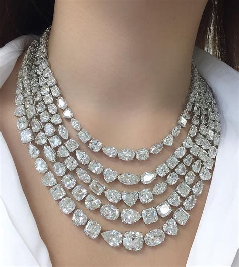 Trying on a necklace composed of 176 diamonds with a total weight of ...