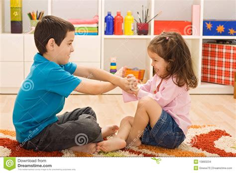 Two children playing stock photo. Image of floor, group ...