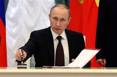 Vladimir Putin mocks EU sanctions threat as Russia takes ...