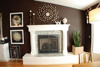 white fireplace mantle and woodwork with dark brown accent ...